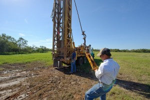 The drilling of a deep water well.