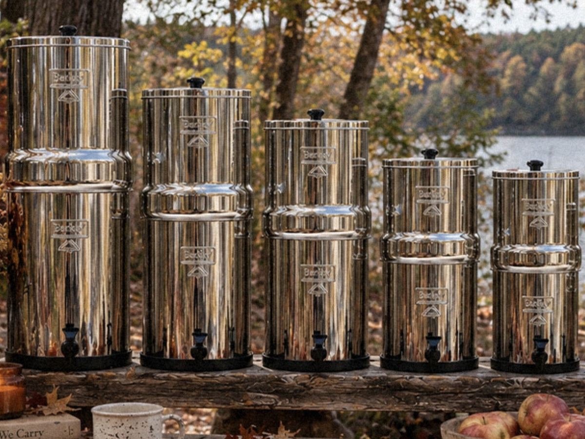 Berkey water filter systems lined up by size: Crown, Imperial, Royal, Big and Travel Berkey